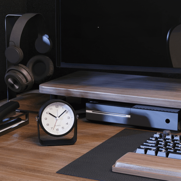 Réveil matin traditionnel noir sur un bureau