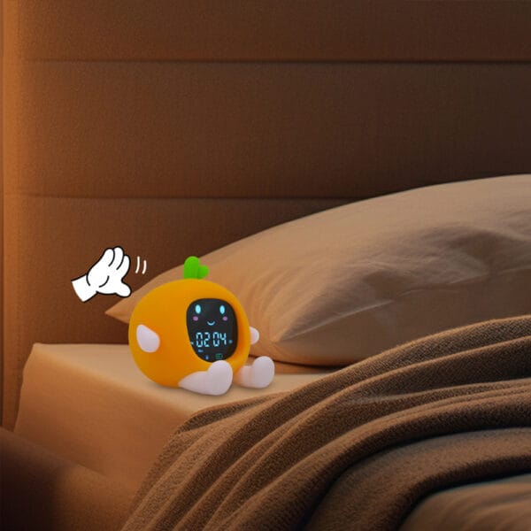 naxjcbasbcvsncv Réveil pédagogique 3 ans jour/nuit orange posé sur un lit